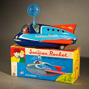 Sonicon Rocket by Masudaya With Original Box. Tin battery operated remote control rocket advances and antenna moves. Tin litho, Japan, 1960.
