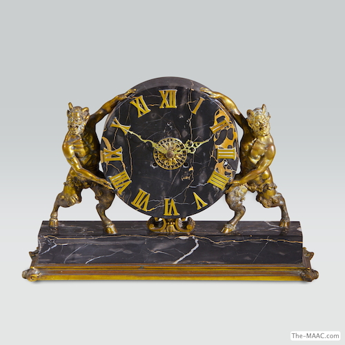 Early 20th Century E. F. Caldwell Clock. Early 29th century E. F. Caldwell clock with jester figures on each end. Bronze and marble, United States, 1900.