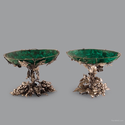 Pair of Buccellati Malachite Centerpieces. Buccellati silver centerpieces with grapes and leaves, the malachite bowl inserts are encrusted with leaves and vines. Silver, Italy.