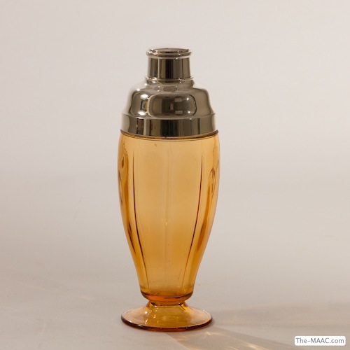   Antique Glass Cocktail Shaker. Amber glass cocktail shaker with silver plate top. Glass and silver plate, England, 1930.  H:  11″  D:  3-3/4″