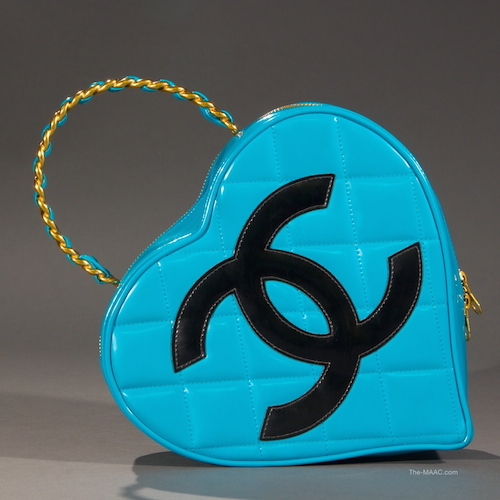 Chanel Turquoise Leather Heart Bag. This heart shaped bag is a very rare turquoise and black color combination. It has a shiny, glossy finish. The bag closes with genuine lampo sippers. Leather, France, 1994-96.