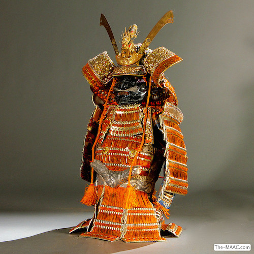 Full set of Samurai armor on doll. Wood and paper, Japan, 20th century.  H:  20″  W:  8″