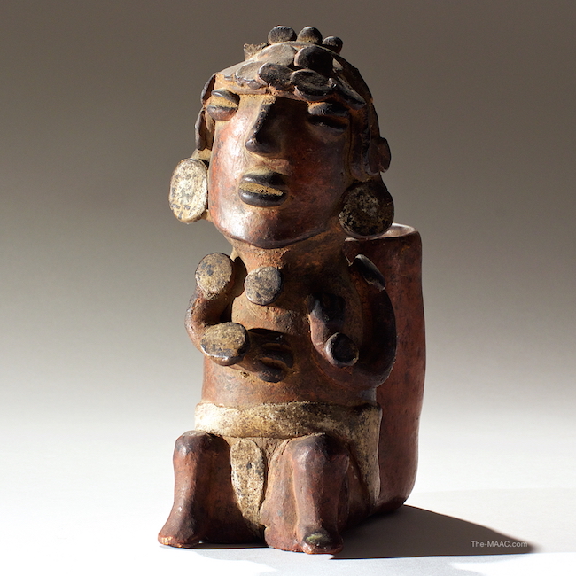  Pre-Columbian Seated Figure. Pottery figure of Priest Colima. Pottery, Mexico, 100 B.C. H: 9″