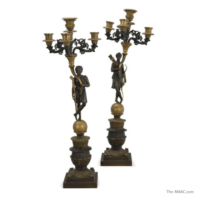 A PAIR OF FRENCH PATINATED AND GILT-BRONZE FIGURAL FOUR-LIGHT CANDELABRA
