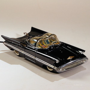 Battery-operated tin car. The Batmobile was designed from this Lincoln with only small changes. Georges Barris modified it in 1966 to make the first Batmobile. Tin, Japan, 1957.