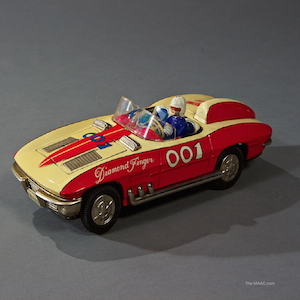 Battery operated Corvette Stingray by Daiya, hood flaps open with pop out lighted machine guns. 1965.