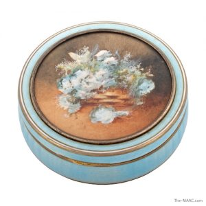  Silver gilt and enamel circular box and cover with a painted floral scene, France, c. 1890.