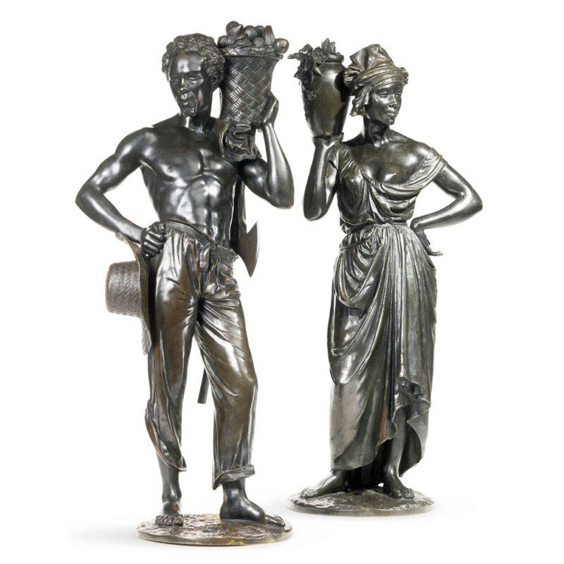 A Fine Pair of Patinated Bronze Sculptures of Native Antilliais