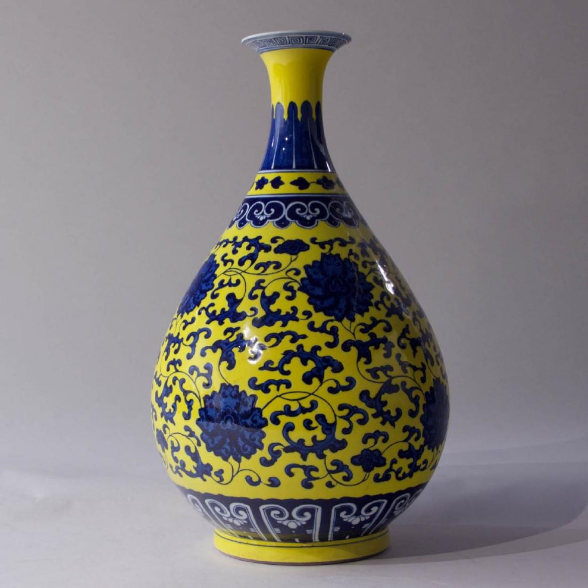 Vase With Blue Peony Flowers on Yellow Ground