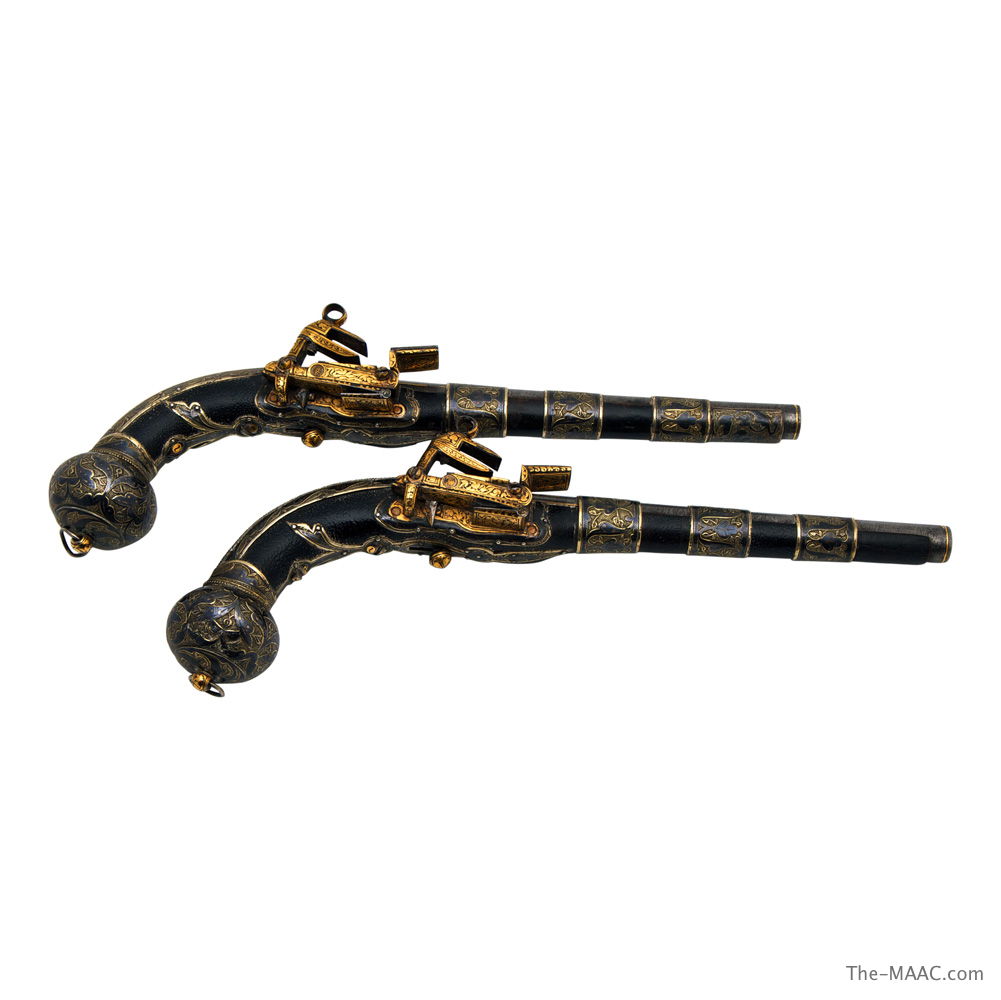 Pair of steel, silver and gold inlaid pistols - at Lev Tov Antiques - at the Manhattan Art & Antiques Center