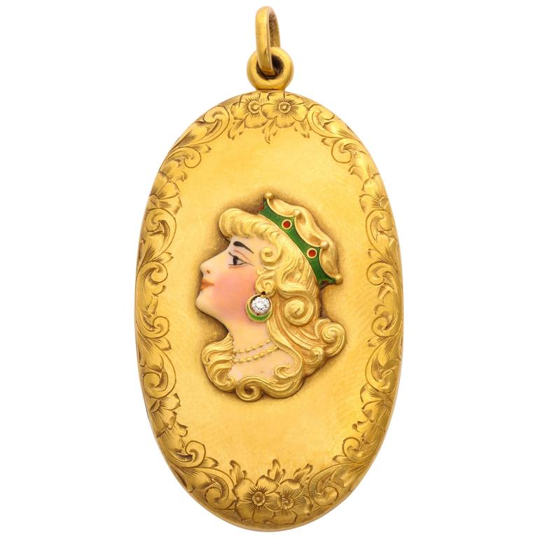 Gold Locket with a woman's face - art nouveau