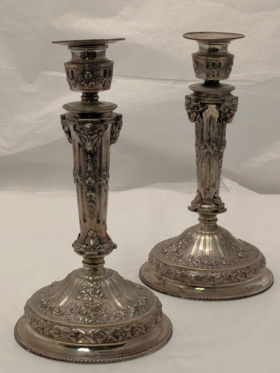 Pair of Silver Candlesticks with Unique Ram Design