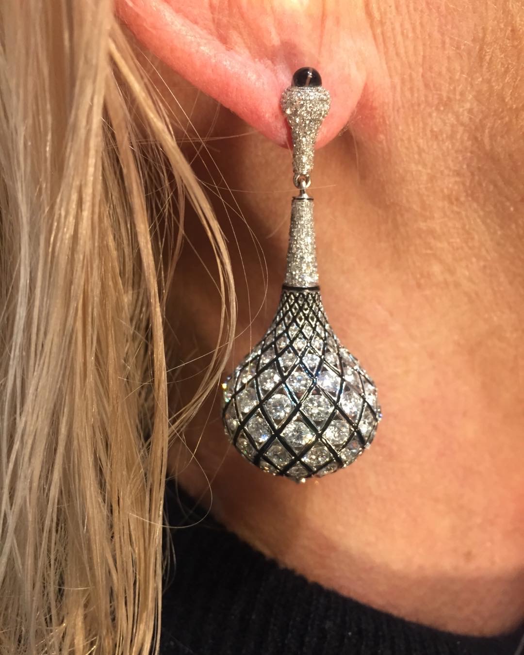 Side of Woman's Face & Ear Wearing a Diamond Ball Earring