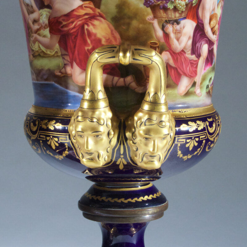 Fine Quality Pair of Vienna Porcelain Urns and Cover with Mask Handles