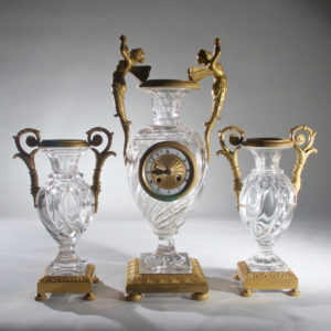 An Elegant French Ormolu and Glass Clock Garniture